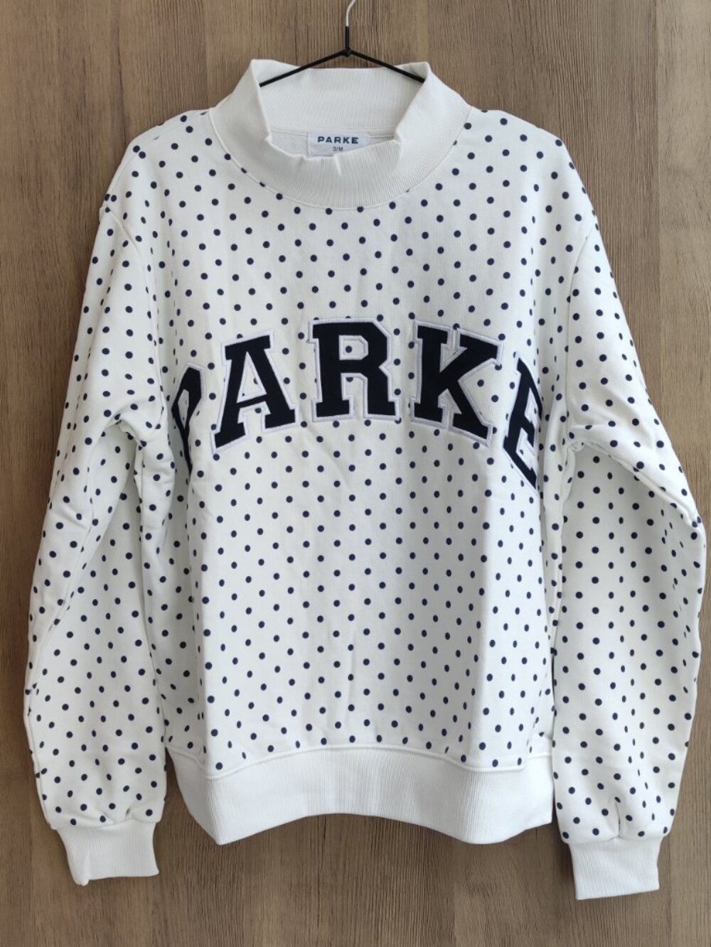 Parke Off‑White Navy Polka Dot Mock Neck Varsity Sweatshirt
